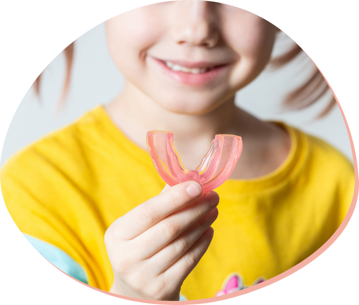 cute-little-girl-with-blond-hair-is-holding-pink-dental-myofunctional-trainer.png cute-little-girl-with-blond-hair-is-holding-pink-dental-myofunctional-trainer