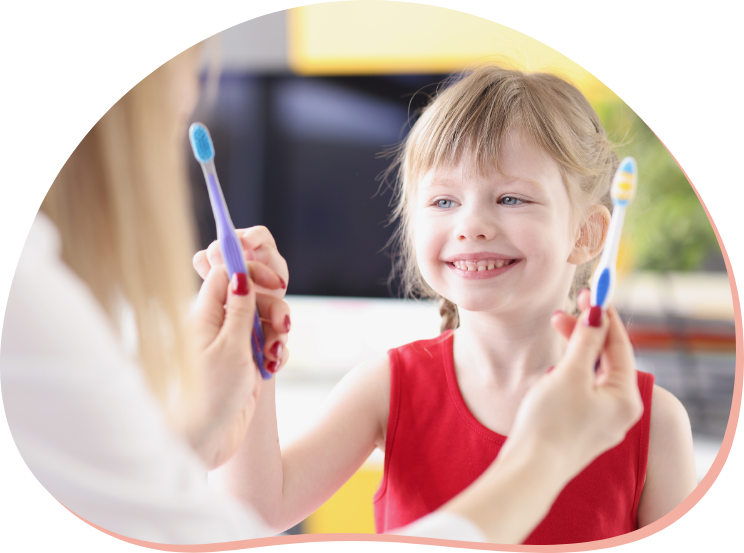 dentist-doctor-offering-little-girl-two-toothbrushes-choose-from-clinic