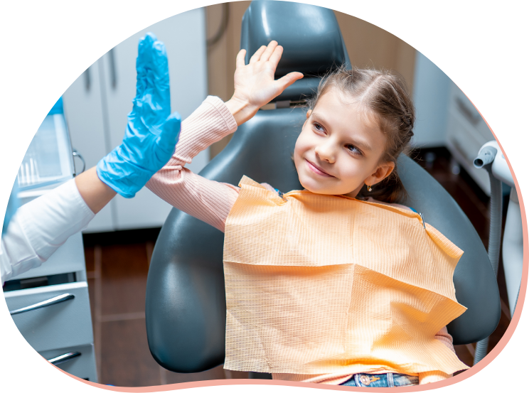friendly-dentist-giving-high-five-little-girl-patient-sitting-dental-chair-after-examination